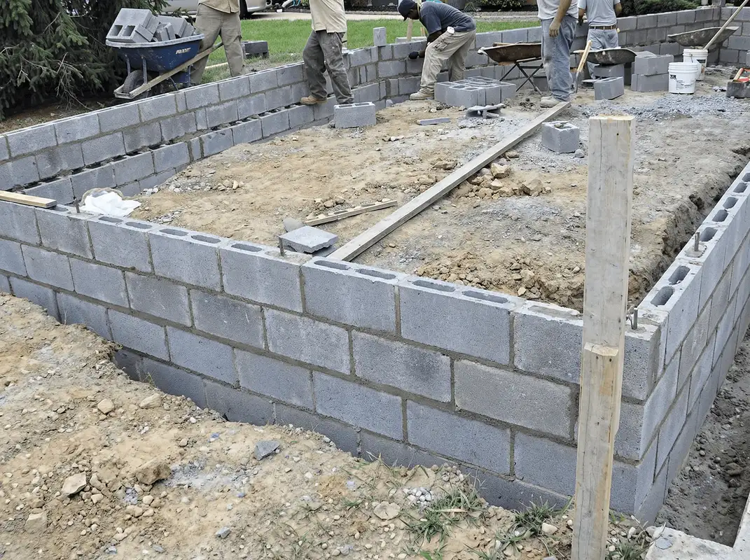 Professionals building a foundation with blocks in Minneapolis, MN