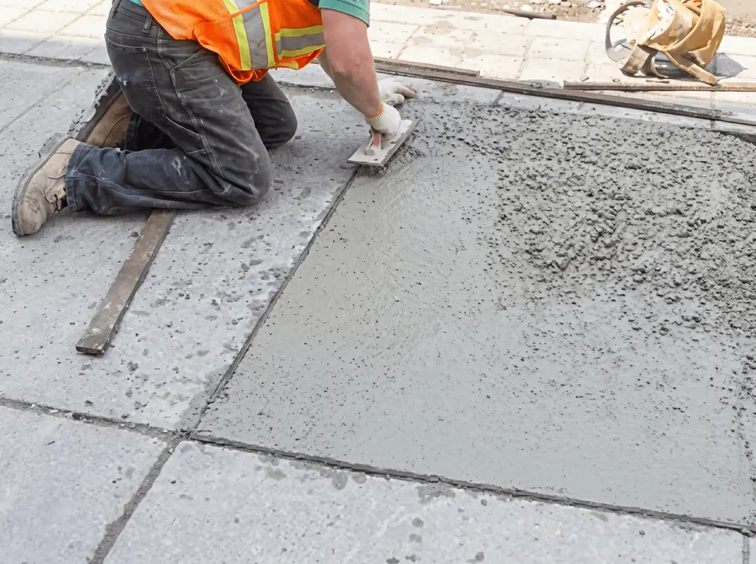 Professional repairing a concrete floor in Minneapolis, MN